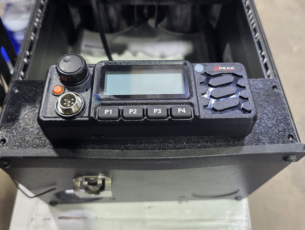 Peak PTT M14G radio head mounted in a console bracket