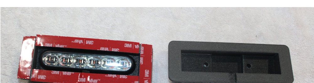 Single shroud alongside a SoundOff mpower LED head with 3M VHB tape